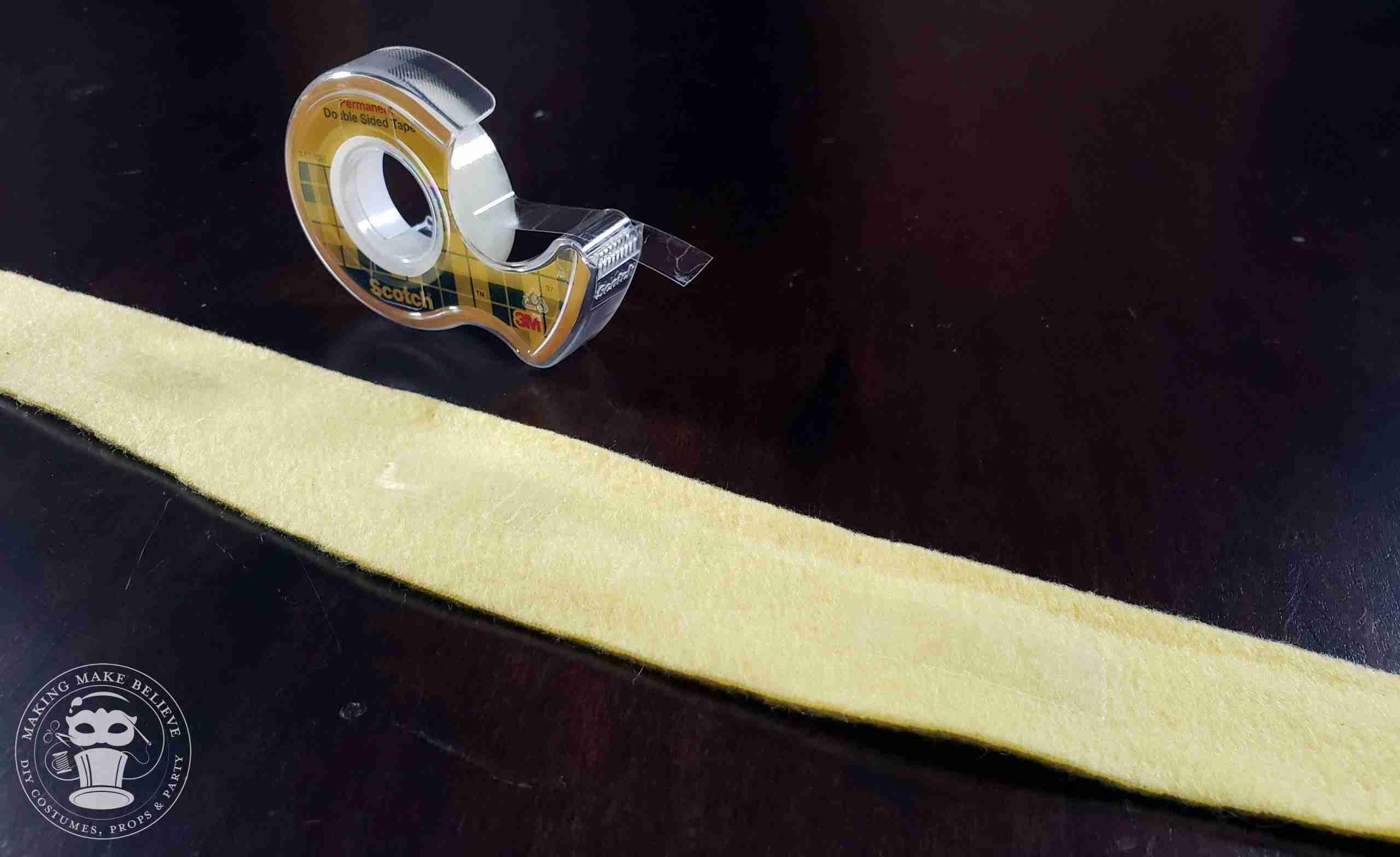Place double-stick tape down the center of wrong side of the cover