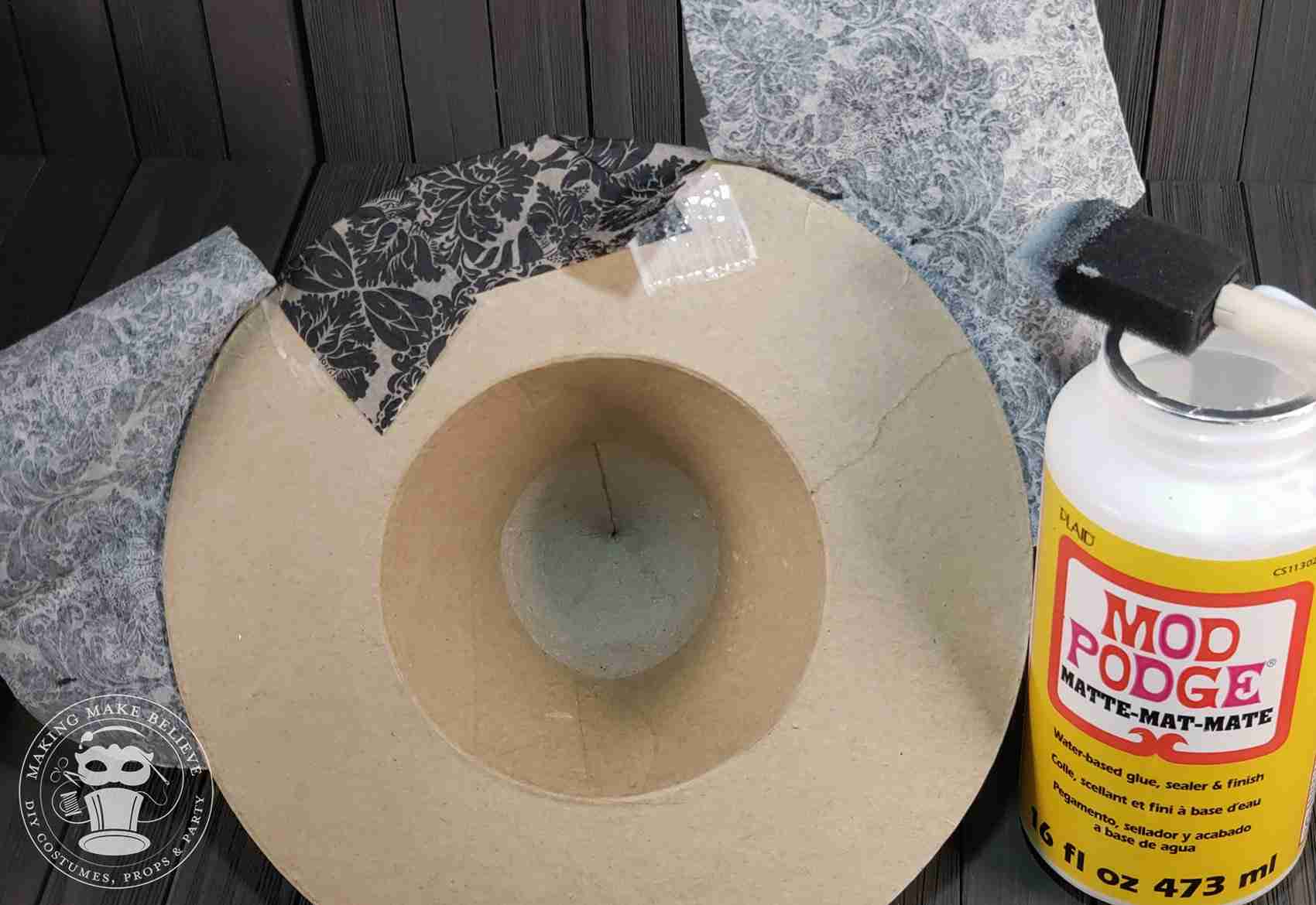 Tuck napkin under brim