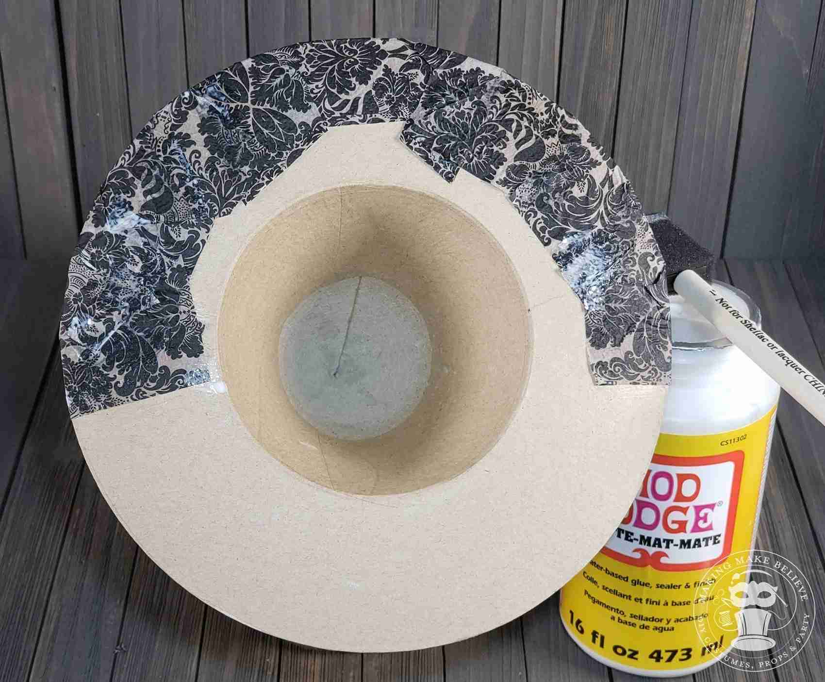 Snip and tuck edge under brim