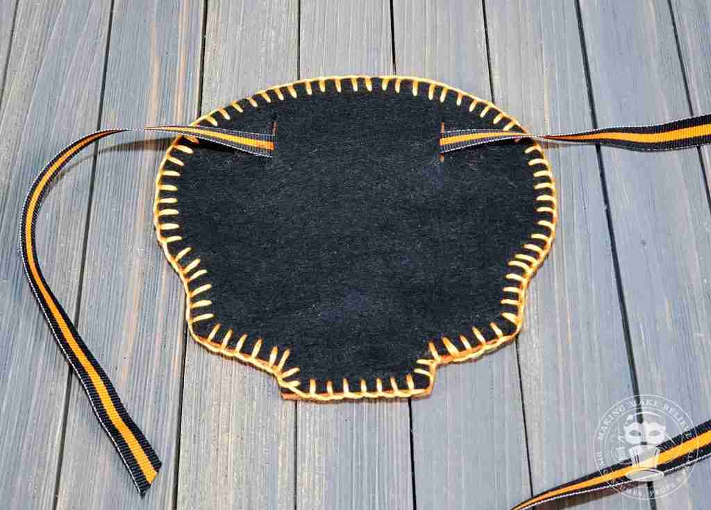 Place ribbon through slits in back