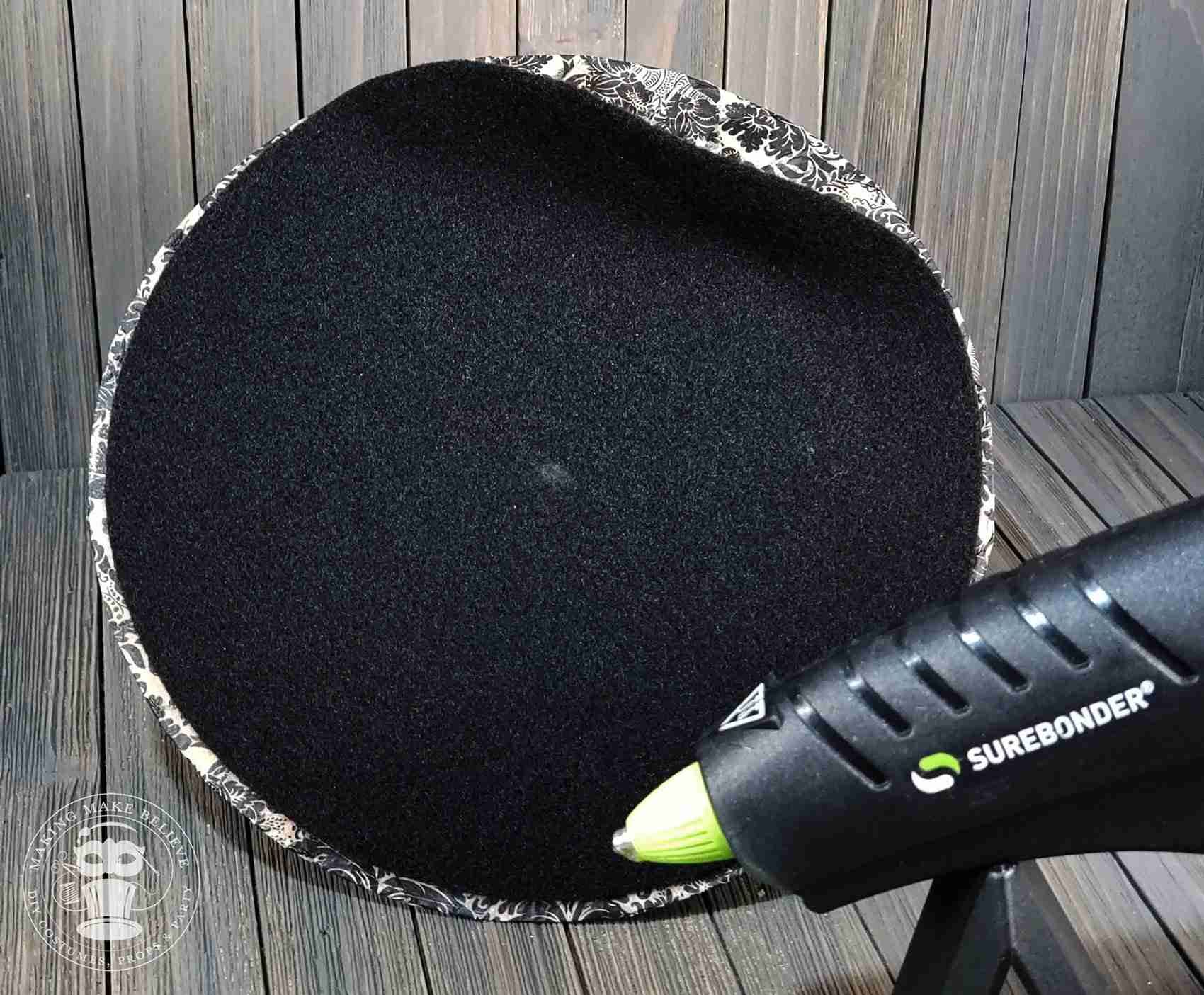 Glue felt to underside of hat