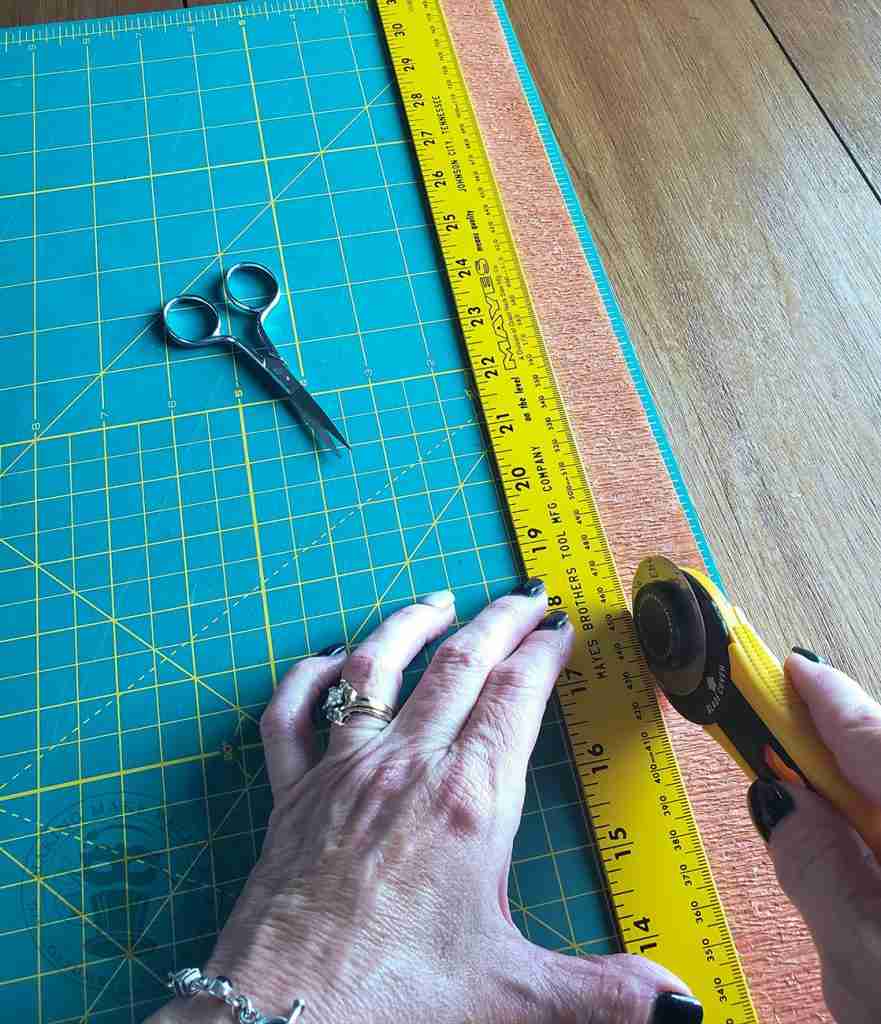 Trim crepe paper streamer to desired witdth