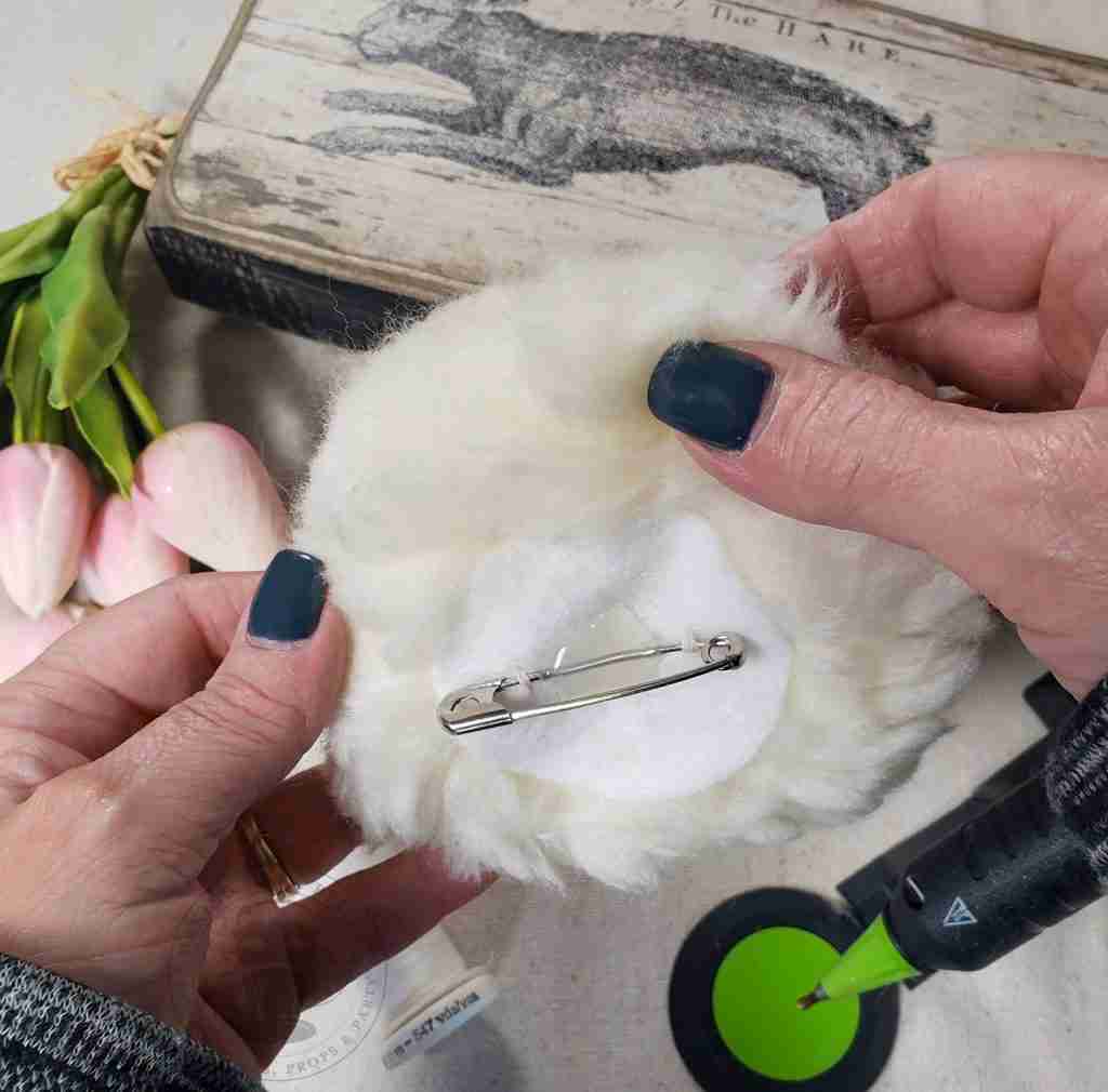 Add Safety Pin To Pom For DIY Fluffy Bunny Tail