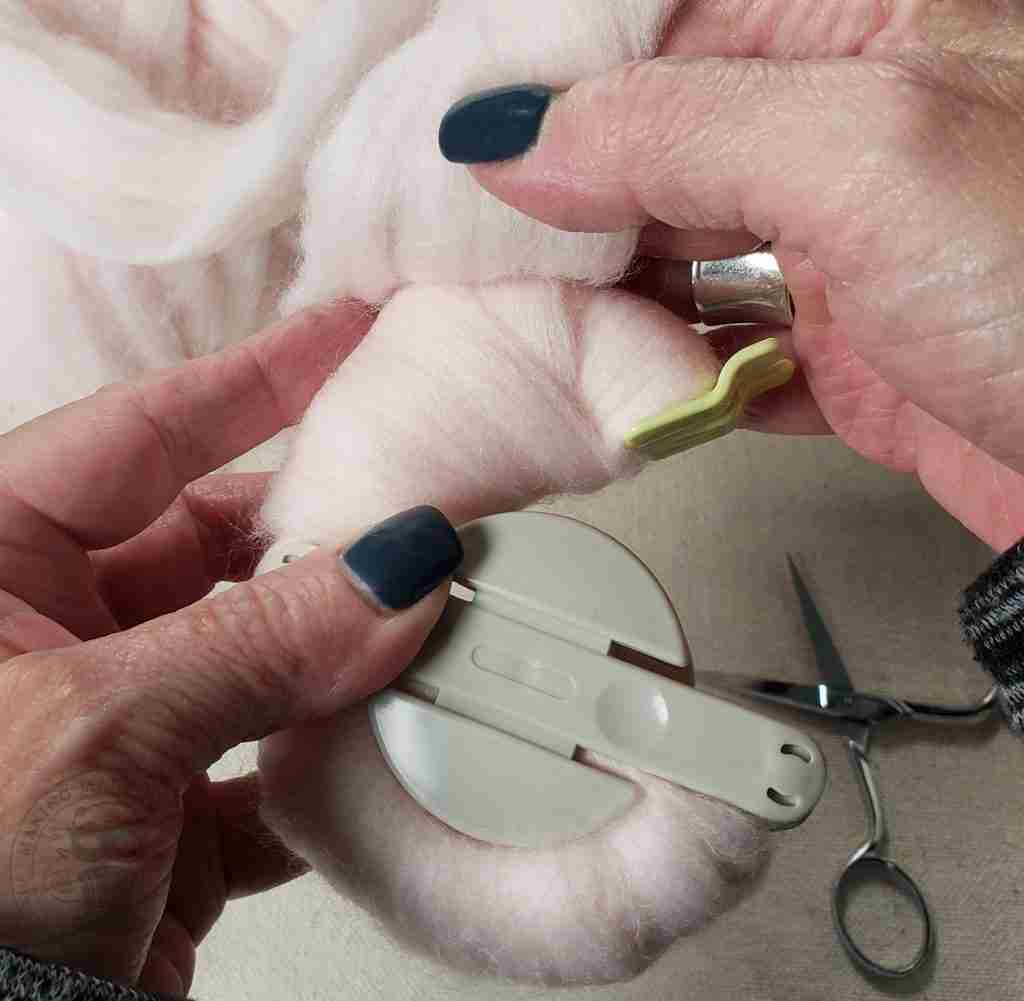 Wrap Yarn Onto Pom Maker
