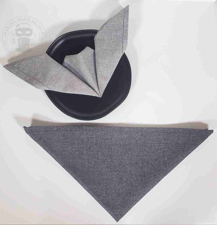 Fold napkin again forming a smaller triangle