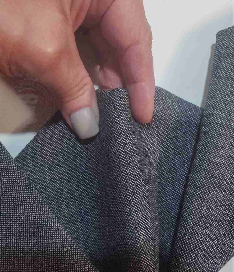 Pinch napkin in the center to form bat ears