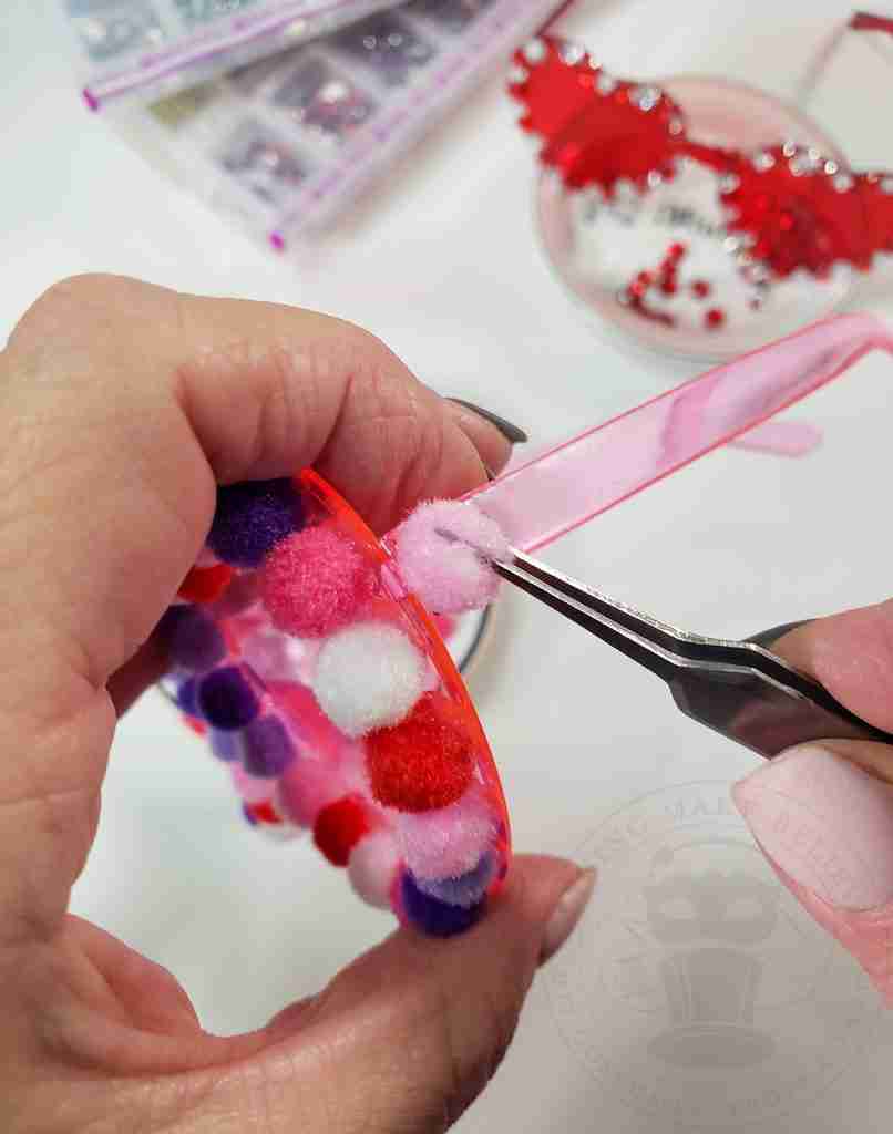 Glue Poms To Earpiece