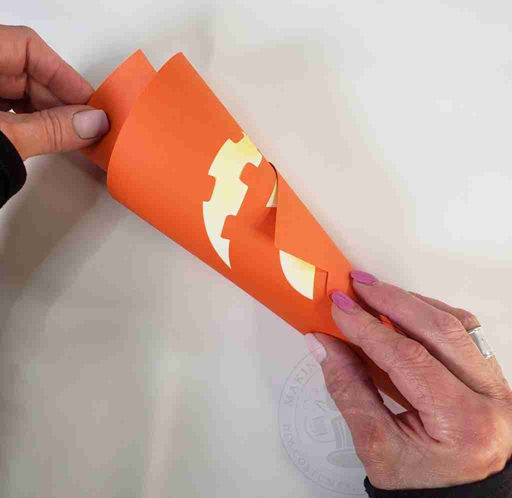 Gently Roll Cardstock To Form Hat