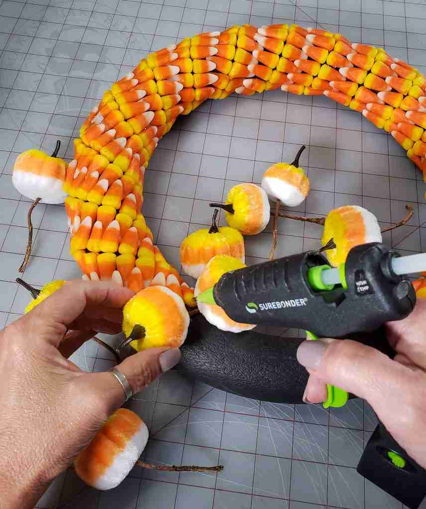 Add Embellishments To Candy Corn Wreath