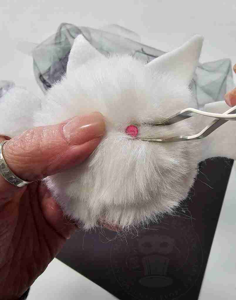 Glue Eyes Onto Pom