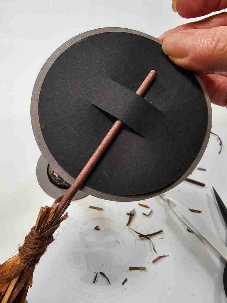 Insert Broom Into Slot on Witch Hat