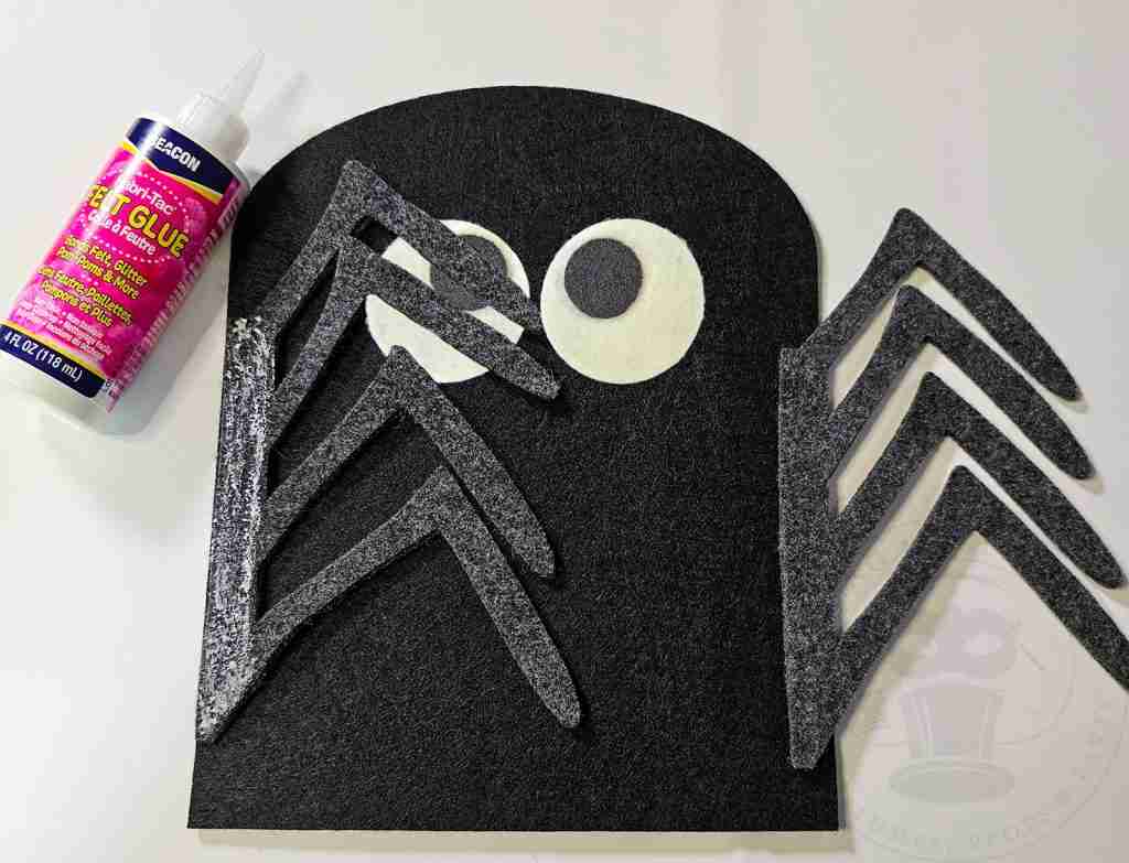 Glue Spider Legs Onto Trick or Treat Sack