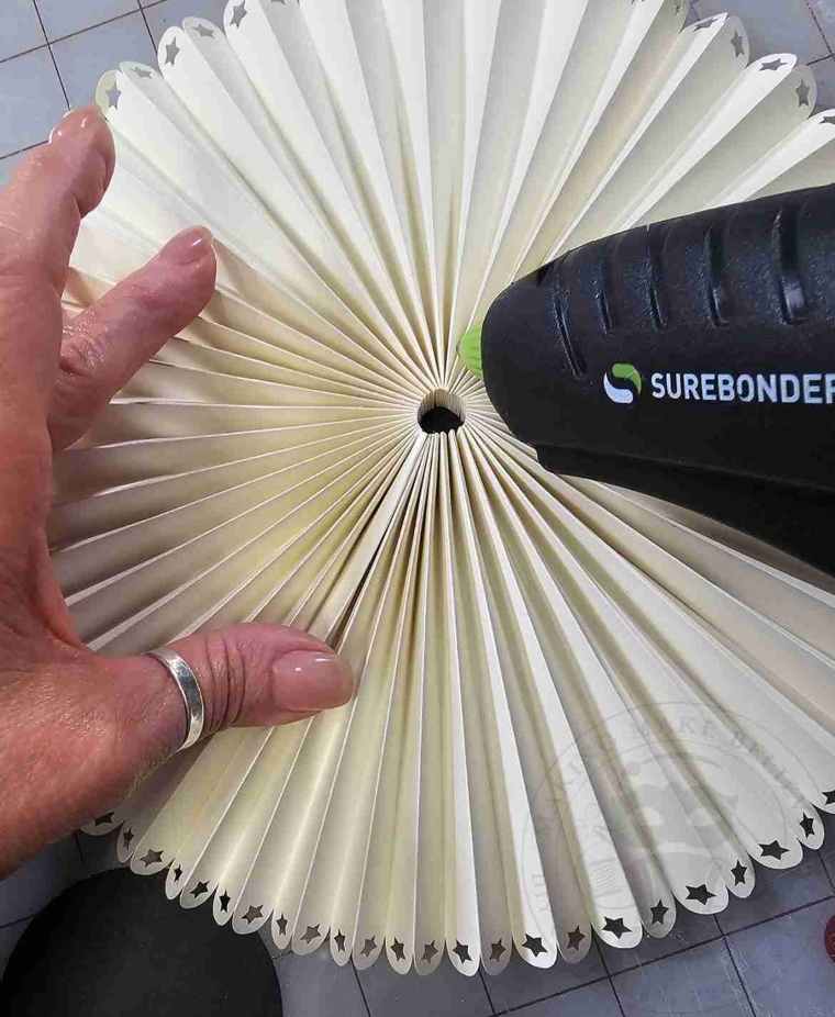 Add hot glue to center