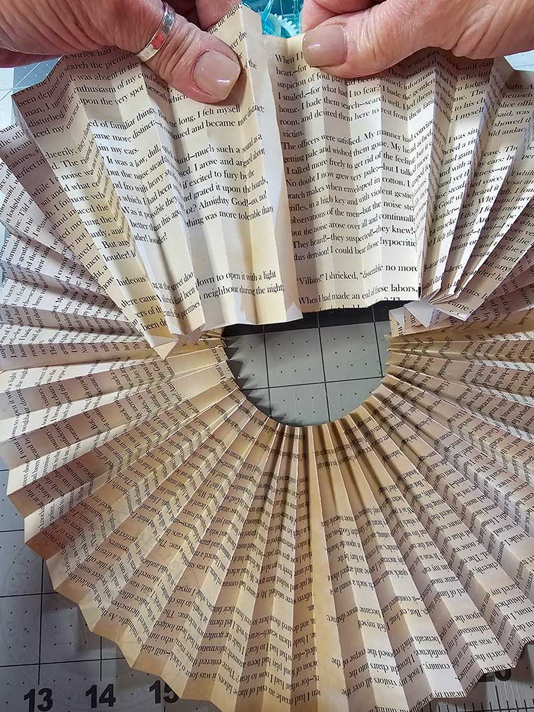 Glue the ends to form a circle