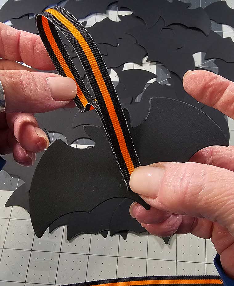 Lay ribbon onto one bat cutout