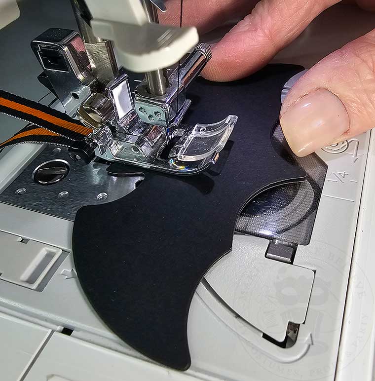 Backstitch and sew down center of bat