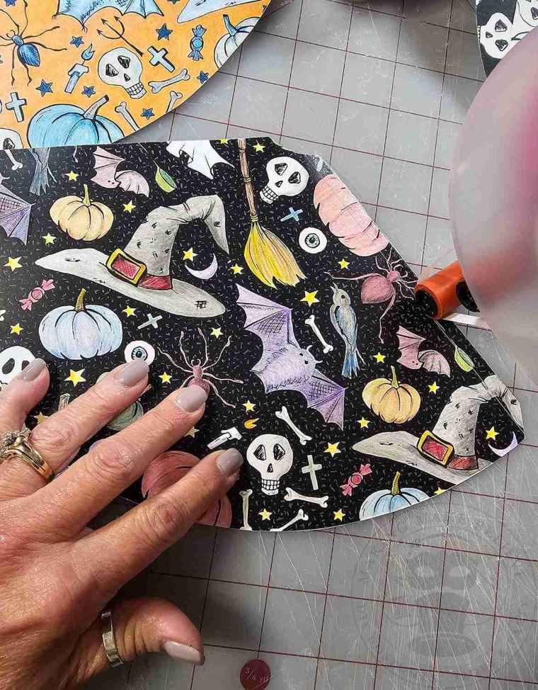 Glue edge of of party hat along fold line