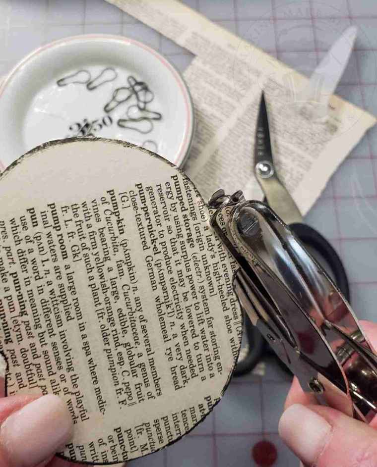 Punch a small hole in Halloween icon cut out