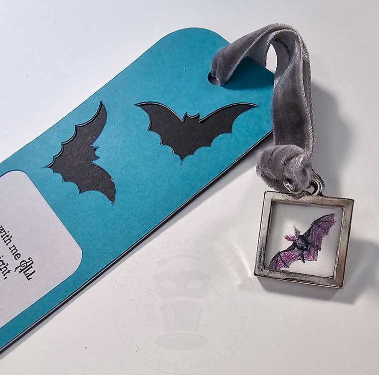 Add a ribbon and charm to bookmark
