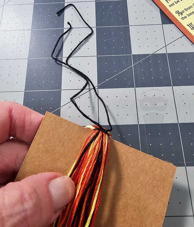 Tie off top of floss wrap