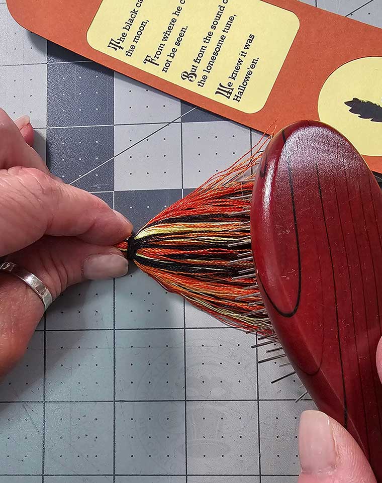 Blend the floss strands with a brush