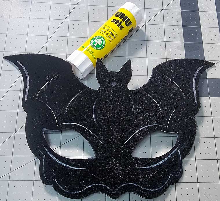 Bat top layer of faux horse hair felt sheet glued into place