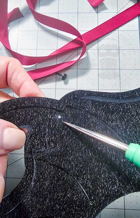 Punch hole through mask layers for ribbon tie