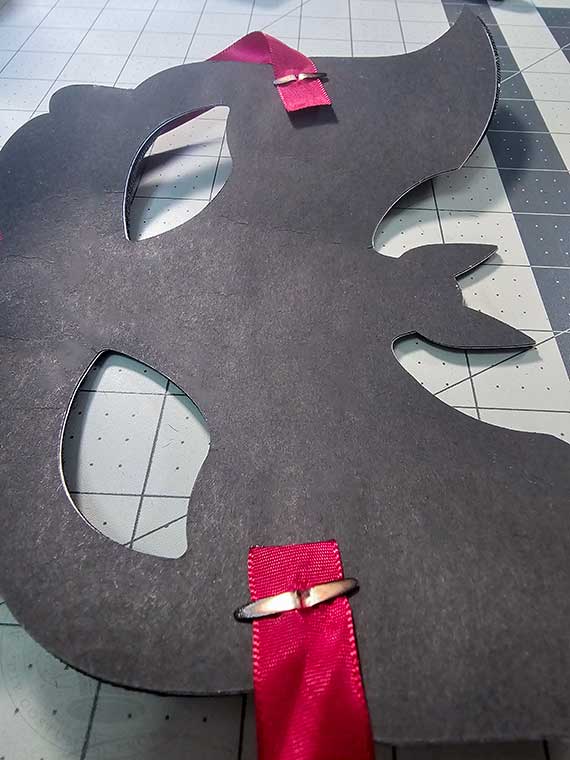 Brad fastener opened securing ribbon tie