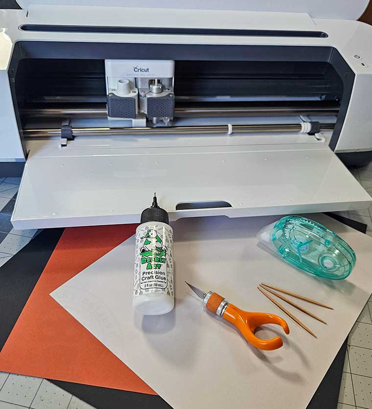 Supplies for DIY Halloween cupcake wrappers and picks