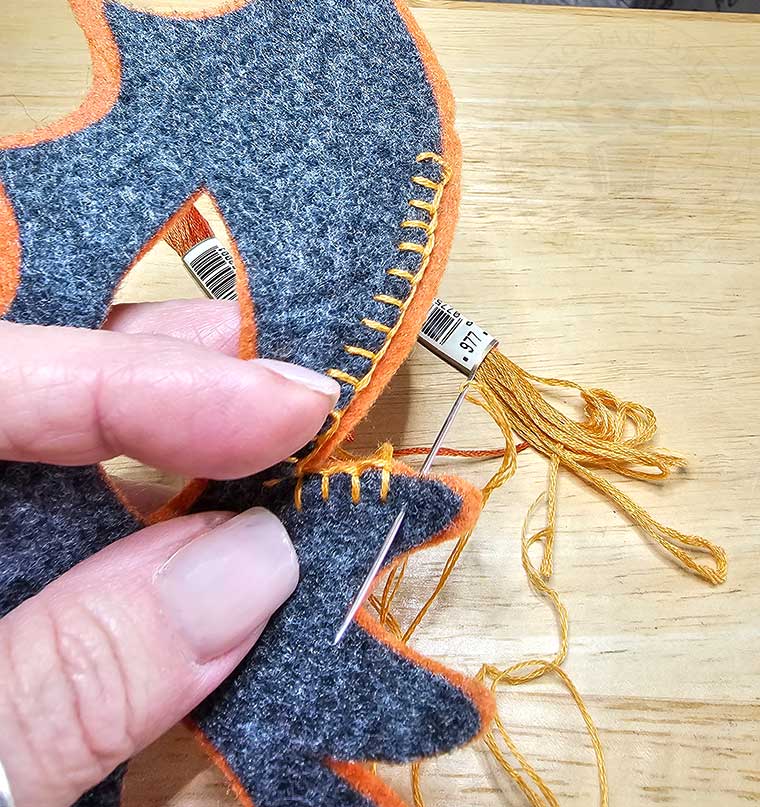 Slow stitch bat mask with blanket stitch