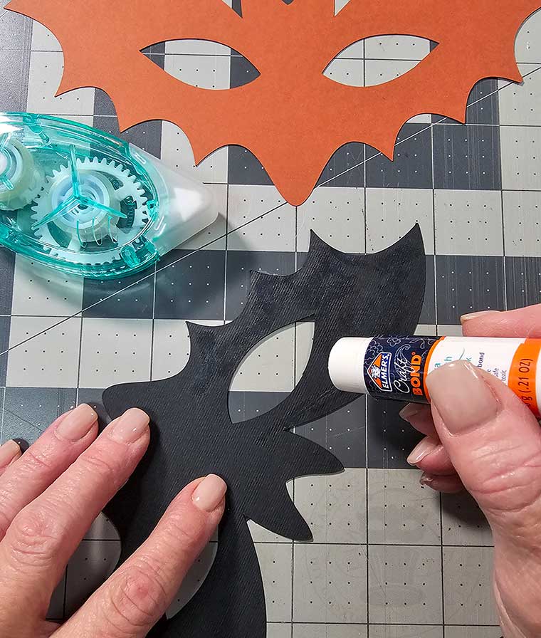 Glue cardstock bat mask top to base