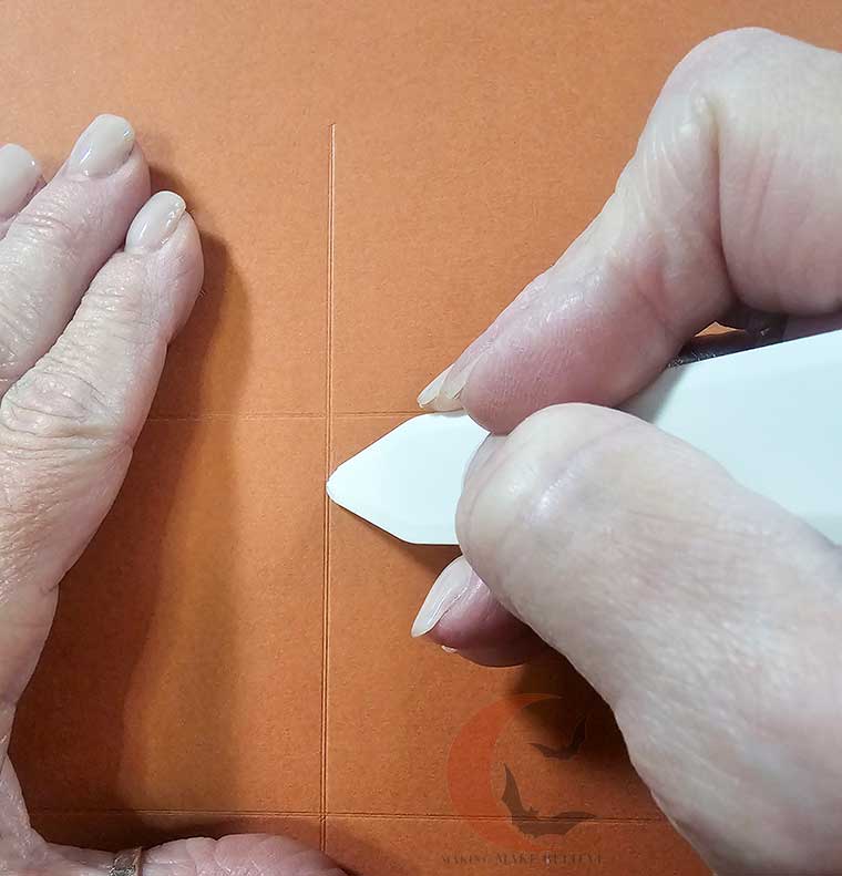 Scoring fold lines on Surprise Treat Box base