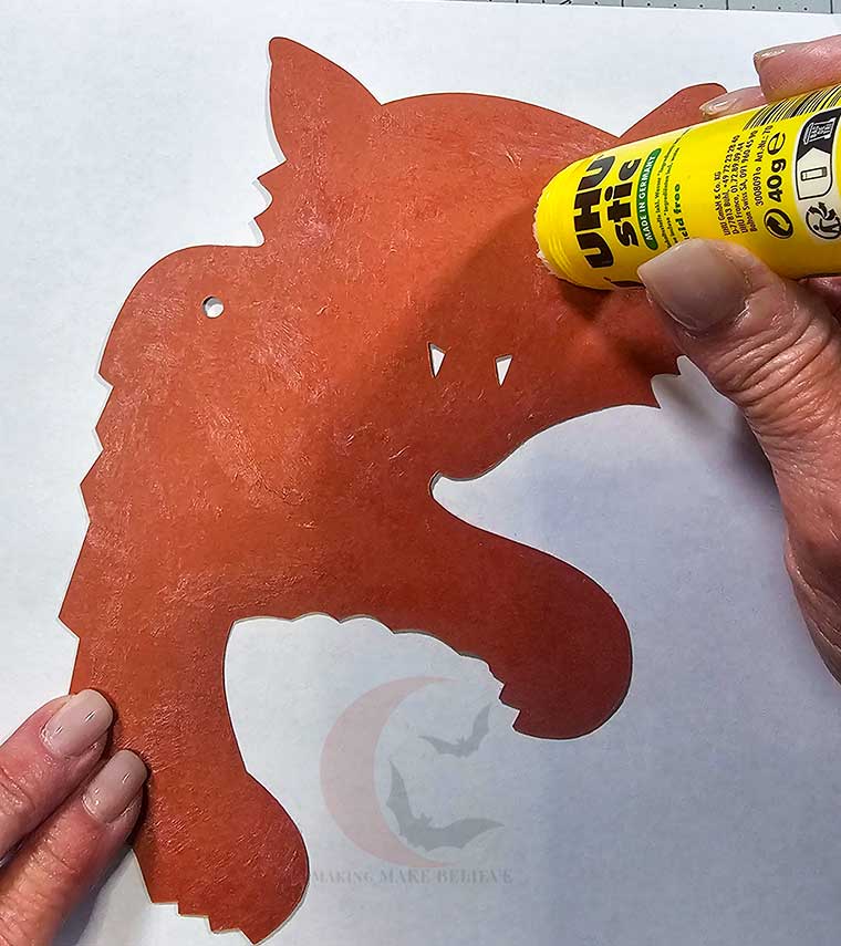Add glue to back of orange front section