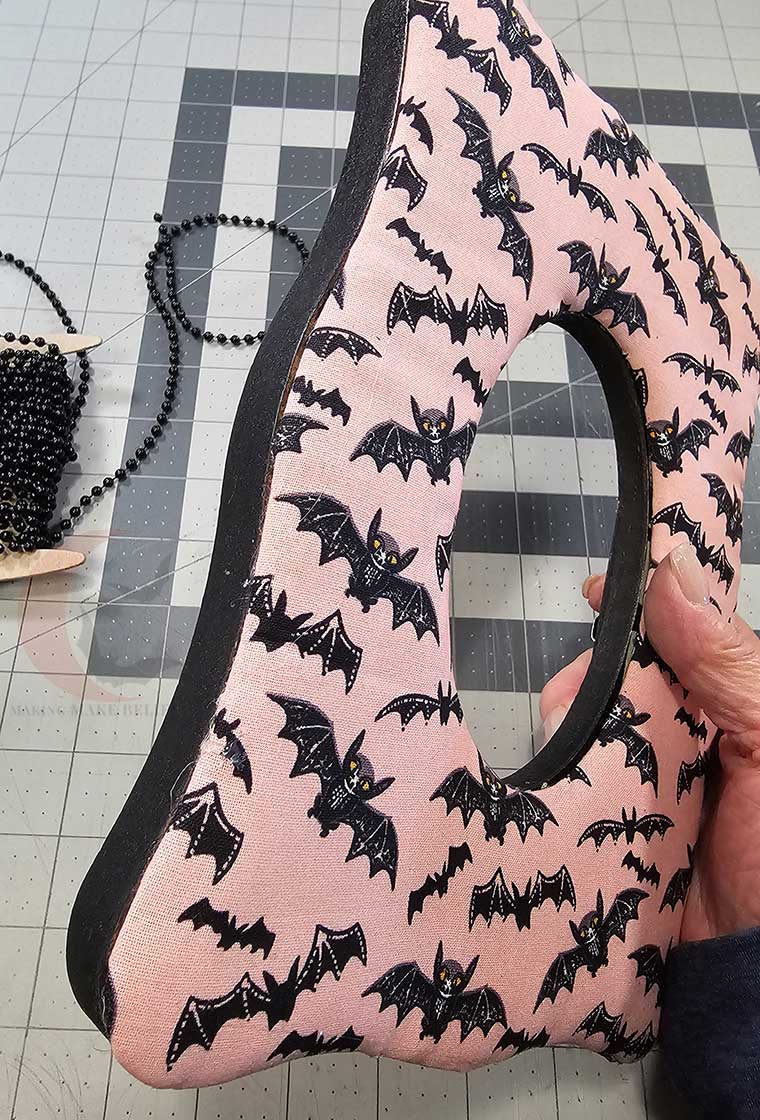Glue padded section to front of frame