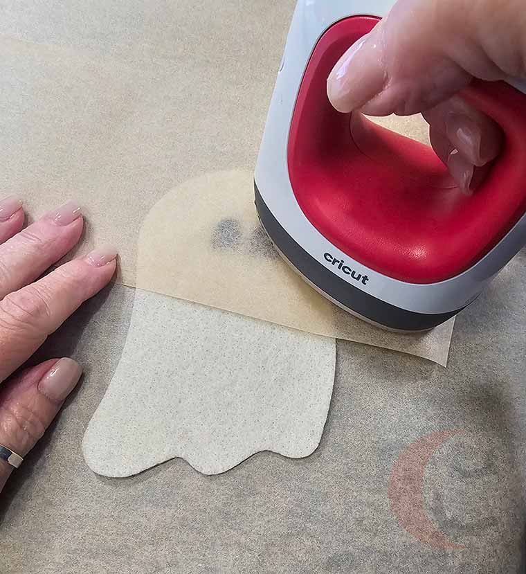 Top felt pieces with parchment and iron to fuse