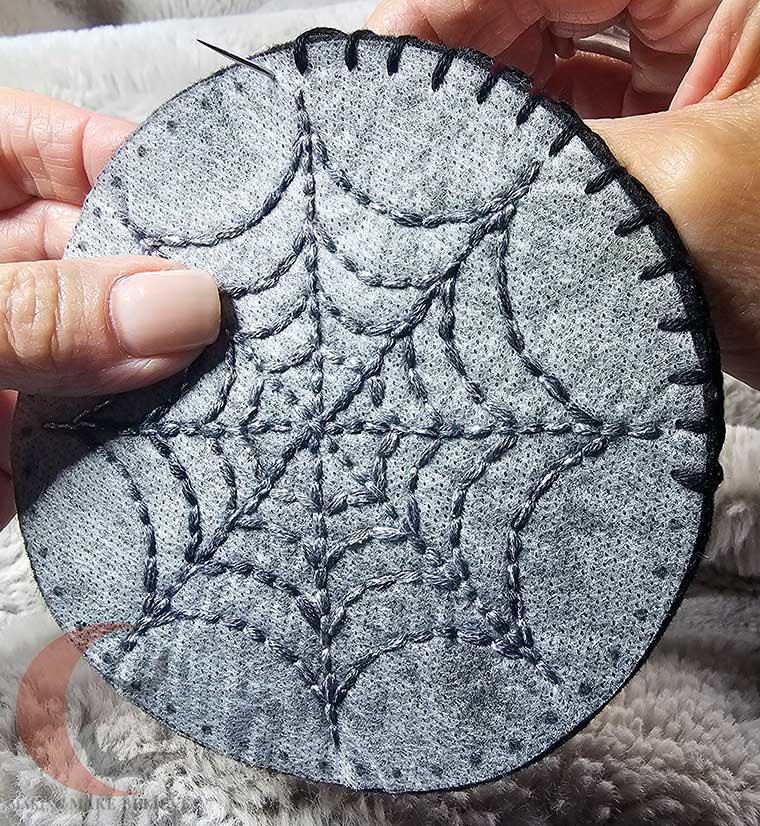 Blanket stitch around coaster edge