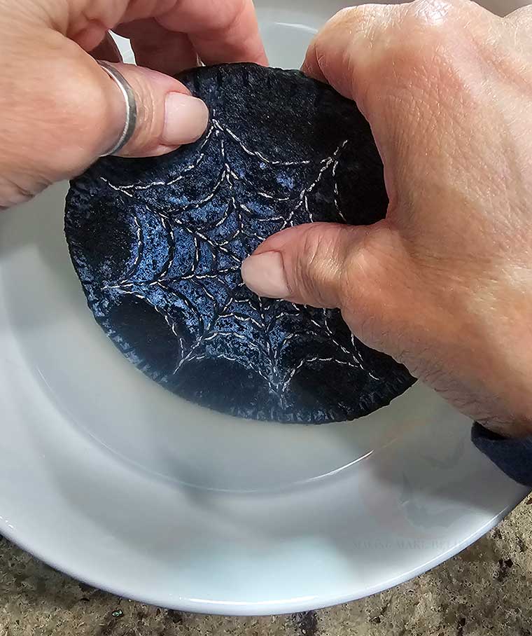 Rub template off under water