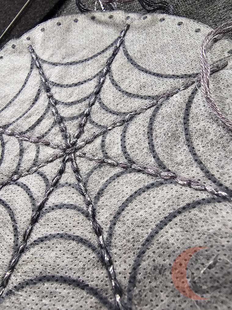 Close up of stitching on spider web coaster